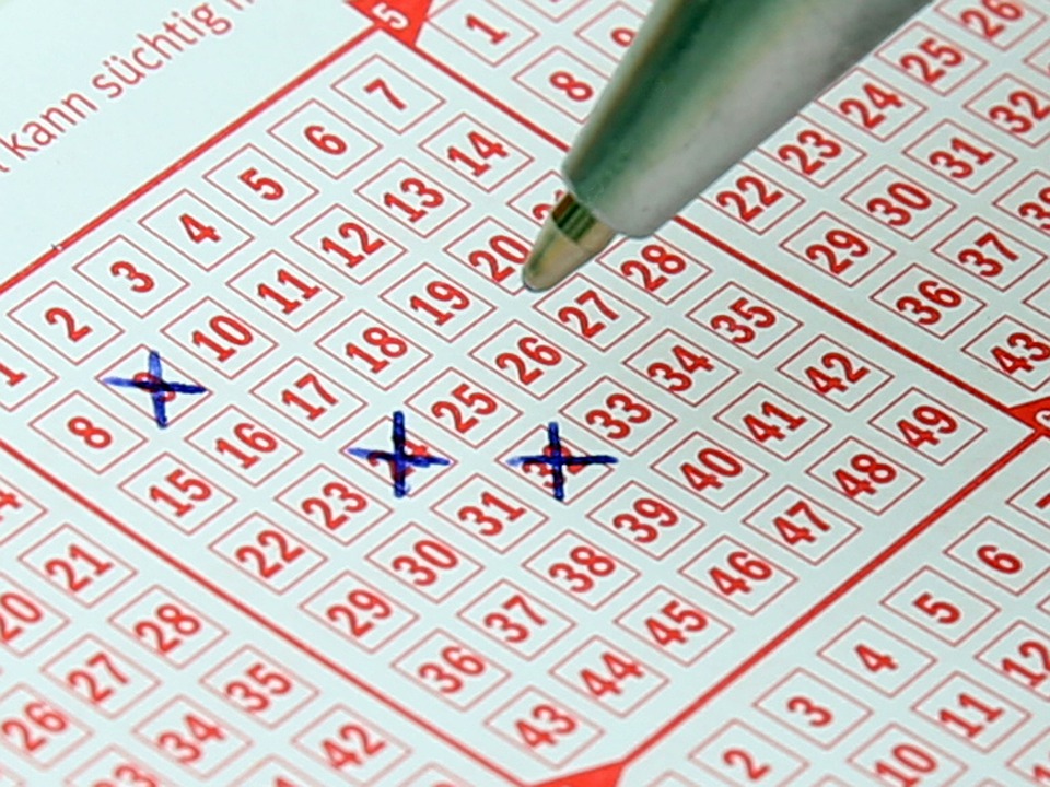 German Lotto card with 9, 24 and 32 crossed out with blue biro pen